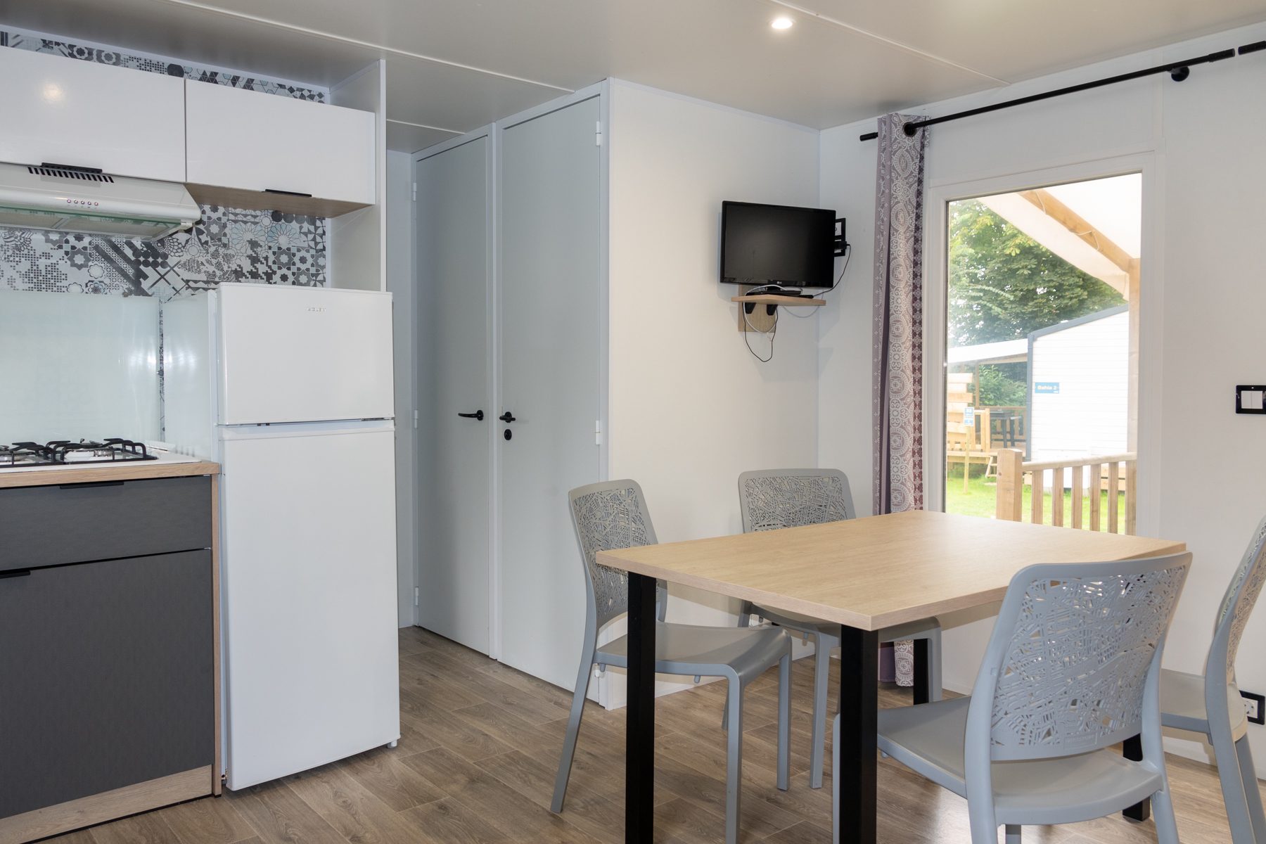 Coin repas d'un mobil-home Famille 3 chambres